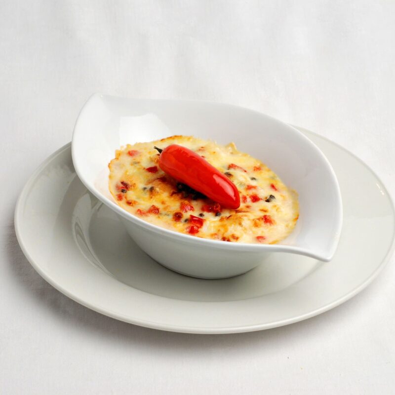 Gratin de poulamon aux échalotes avec un poivron rouge.